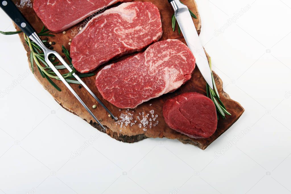 Steak raw. Barbecue Rib Eye Steak, dry Aged Wagyu Entrecote. Variety of Raw Black Angus Prime meat steaks Machete, Striploin, Rib eye, Tenderloin fillet mignon