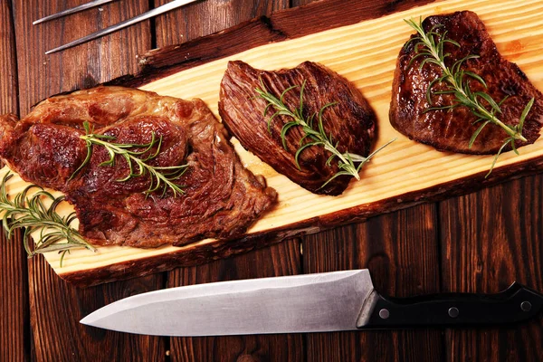 Barbecue Rib Eye Steak. Black Angus Prime meat steaks Machete, Striploin, Rib eye, Tenderloin fillet mignon