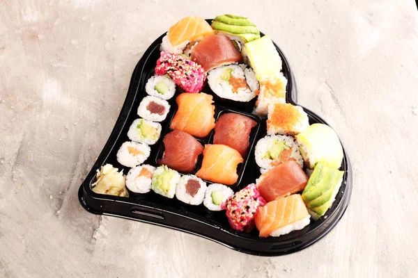close up of sashimi sushi set with chopsticks and soy - sushi ro