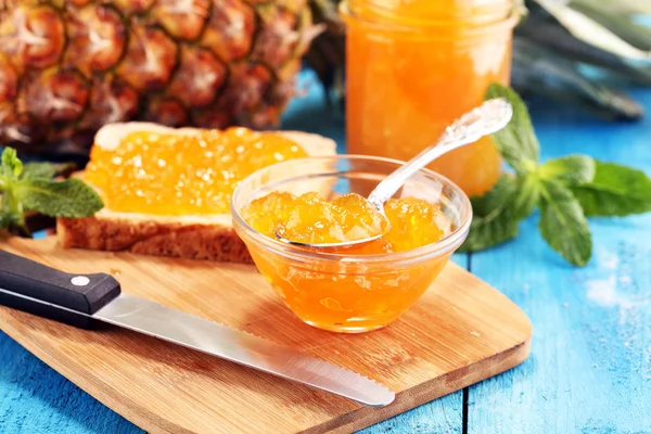 pineapple jam with fresh pineapple and mint. marmalade on spoon