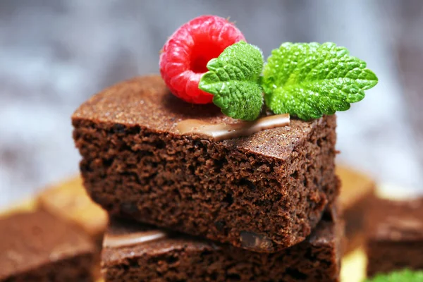 chocolate brownie cake dessert with raspberry and spices on a ru