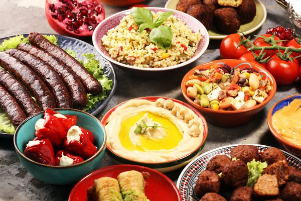 Middle eastern or arabic dishes and assorted meze, concrete rust — Stock Photo, Image