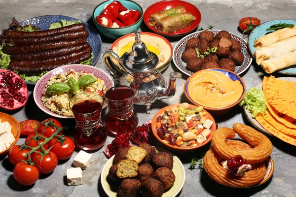 Middle eastern or arabic dishes and assorted meze, concrete rust — Stock Photo, Image