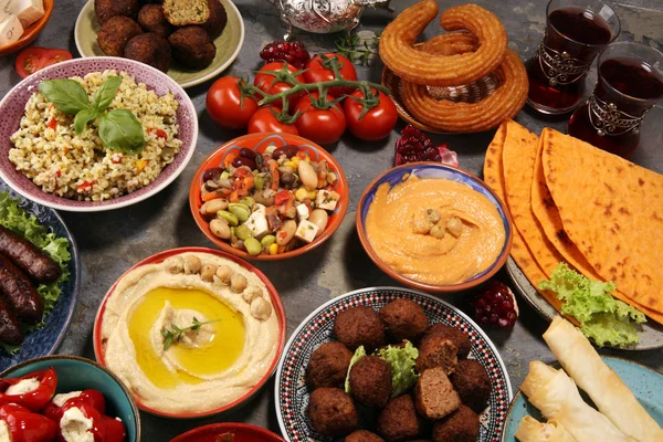 Middle eastern or arabic dishes and assorted meze, concrete rust — Stock Photo, Image