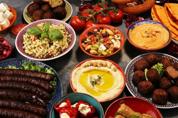 Middle eastern or arabic dishes and assorted meze, concrete rust — Stock Photo, Image