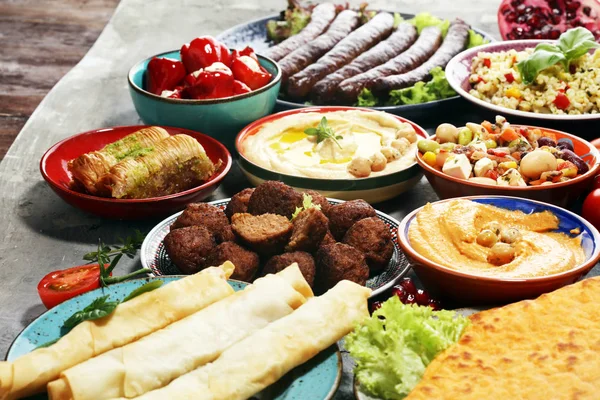 Middle eastern or arabic dishes and assorted meze, concrete rust — Stock Photo, Image