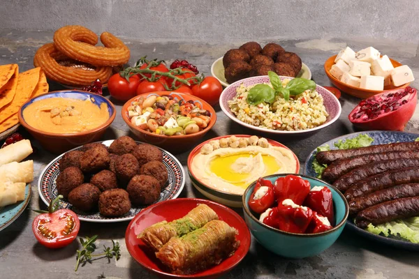 Middle eastern or arabic dishes and assorted meze, concrete rust — Stock Photo, Image