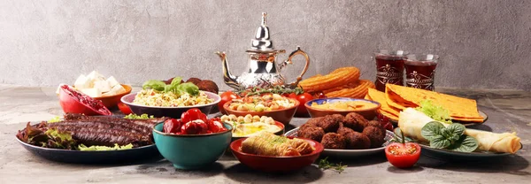 Middle eastern or arabic dishes and assorted meze, concrete rust — Stock Photo, Image
