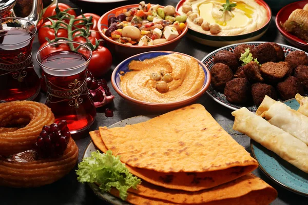 Middle eastern or arabic dishes and assorted meze, concrete rust — Stock Photo, Image