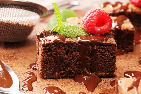 Chocolate brownie cake dessert with raspberry and spices on a ru — Stock Photo, Image