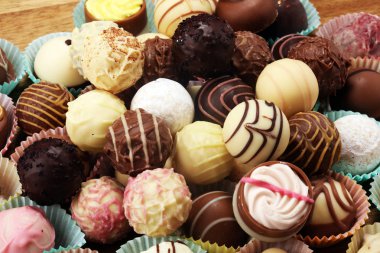 a lot of variety chocolate pralines, belgian confectionery gourm clipart