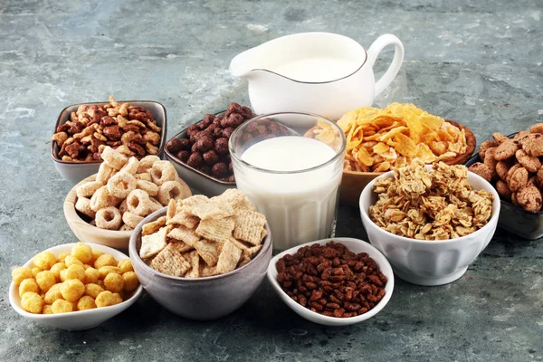 Cereal. Bowls of various cereals and milk for breakfast. Muesli Stock Image