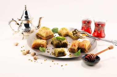 Middle eastern or arabic dishes. Turkish Dessert Baklava with pi clipart