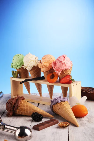 Ice cream scoops of different colors and flavours with berries, — Stock Photo, Image