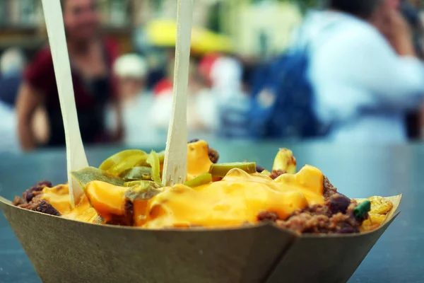 Poutine with French Fries and Chili con Carne, Street Food, dish