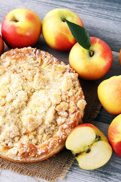 Apple pie or homemade cake with apples on wood. Delicous dessert