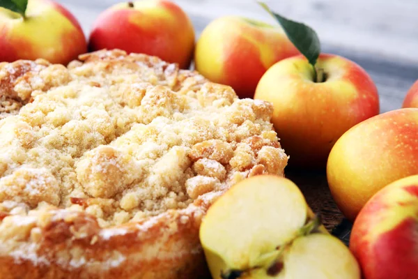 Apple pie or homemade cake with apples on wood. Delicous dessert