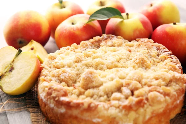 Apple pie or homemade cake with apples on wood. Delicous dessert