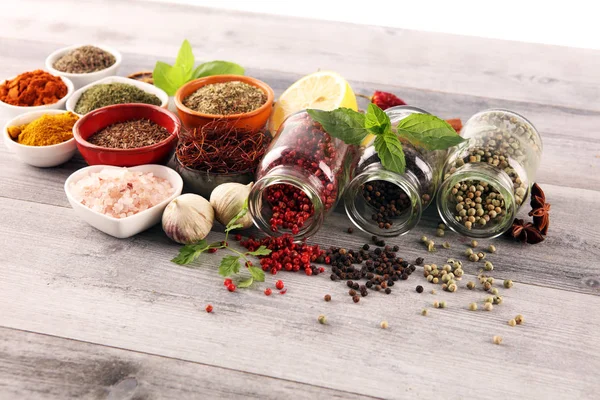 Spices and herbs on table. Food and cuisine ingredients with bas — Stock Photo, Image