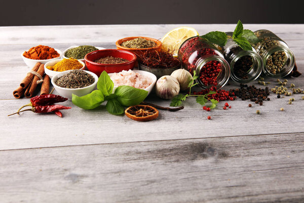 Spices and herbs on table. Food and cuisine ingredients with bas