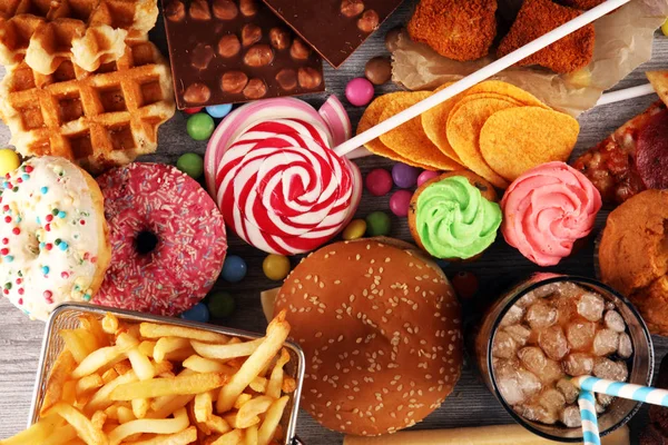 Unhealthy products. food bad for figure, skin, heart and teeth. — Stock Photo, Image