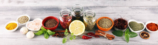 Spices and herbs on table. Food and cuisine ingredients with bas