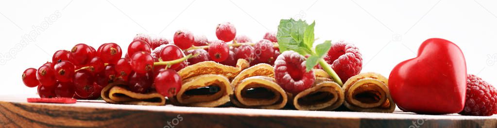 Delicious Tasty Homemade crepes or pancakes with raspberries and
