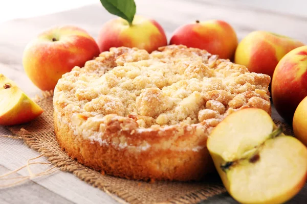 Apple pie or homemade cake with apples on wood. Delicous dessert
