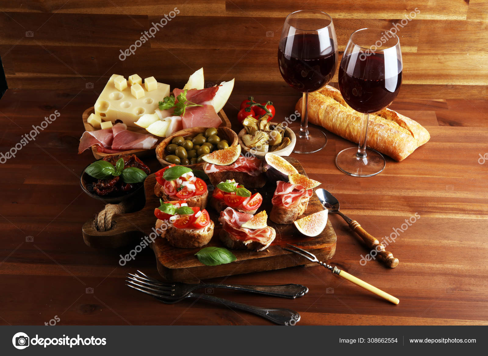 Tasty savory tomato Italian appetizers and bread with coppa and ⬇ Stock