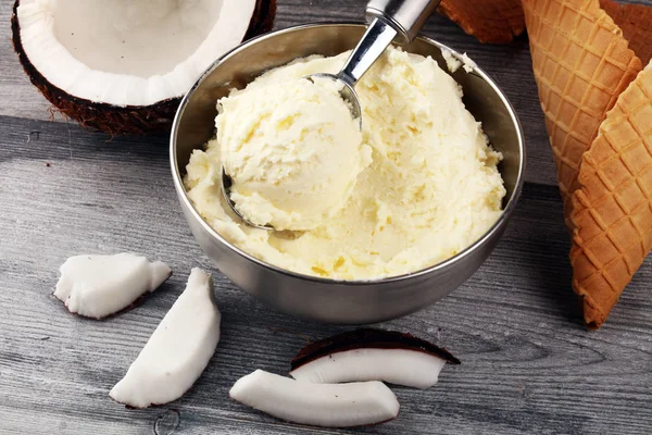 coconut ice cream scoop on a rustic table