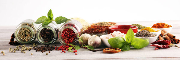 Spices and herbs on table. Food and cuisine ingredients with bas