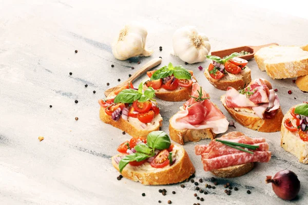 Assorted bruschetta with various toppings. Appetizing bruschetta — Stock Photo, Image