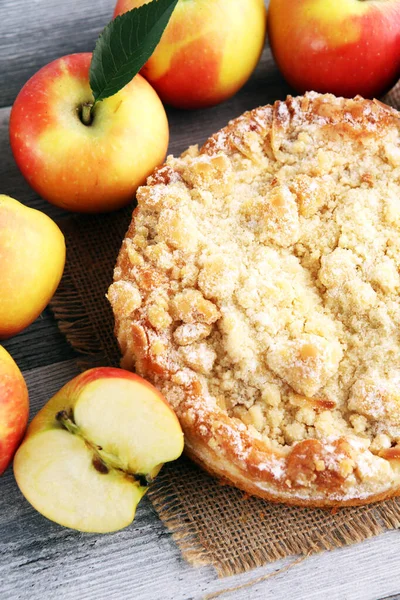 Apple pie or homemade cake with apples on wood. Delicous dessert