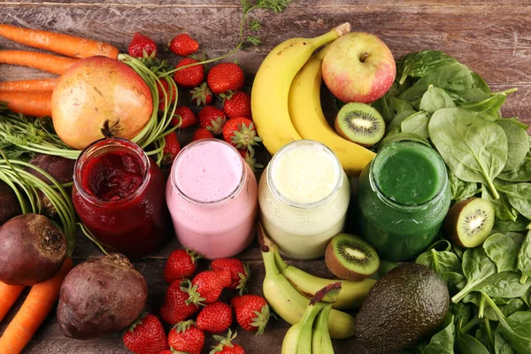 Multicolored smoothies and juices from vegetables, greens, fruits and berries, healthy food background. Detox and dieting, clean eating, healthy lifestyle concept