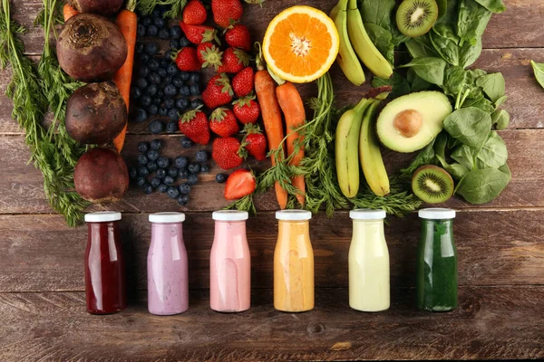 Multicolored smoothies and juices from vegetables, greens, fruits and berries, healthy food background. Detox and dieting, clean eating, healthy lifestyle concept