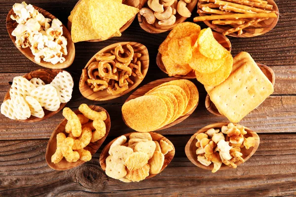 Salty Snacks Pretzels Chips Crackers Wooden Bowls Unhealthy Products Food — Stock Photo, Image