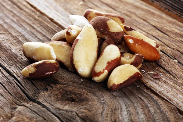 Brazil nuts on vintage background. unshelled healthy vegetarian food