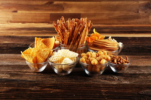 Salty Snacks Pretzels Chips Crackers Glass Bowls Unhealthy Products Food — Stock Photo, Image