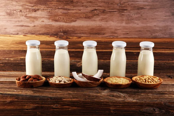 Various vegan plant based milk alternatives and ingredients. Dairy free milk substitute drink, healthy eating.