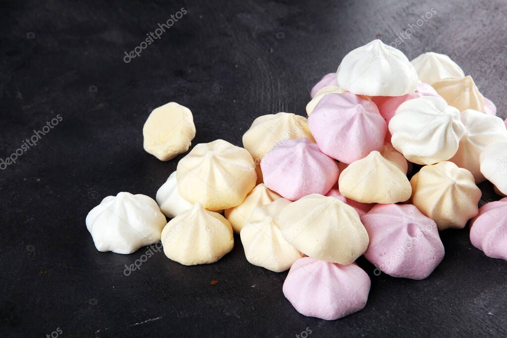 Meringue. Crispy white and pink twisted meringue. Concept love of sweet with sugar