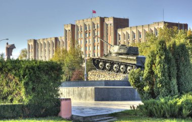 TIRASPOL, TRANSNISTRIA - OCTOBER 20: parliament building and tank on October 20, 2013  clipart