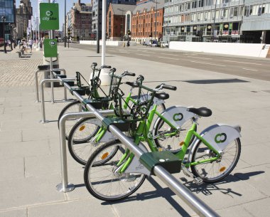 LIVERPOOL, UNITED KINGDOM - JUNE 23: bicycles of the City Bike public cycle hire scheme on June 23, 2014  clipart