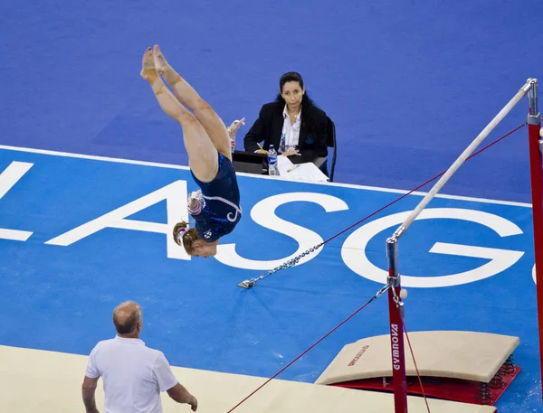 GLASGOW, UNITED KINGDOM - JULY 30: unidentified Scottish gymnast on Uneven Bars in Ladies All Around B Final at Commonwealth Games in SSE Hydro on July 30, 2014