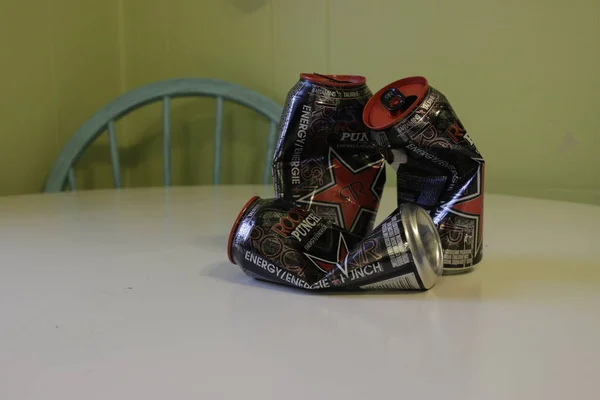 London Canada, January 01 2019: Editorial Illustrative photo of three crushed up rockstar energy drinks that have been drank. Rockstar energy drinks can be dangerous if you drink to many — Stock Photo, Image