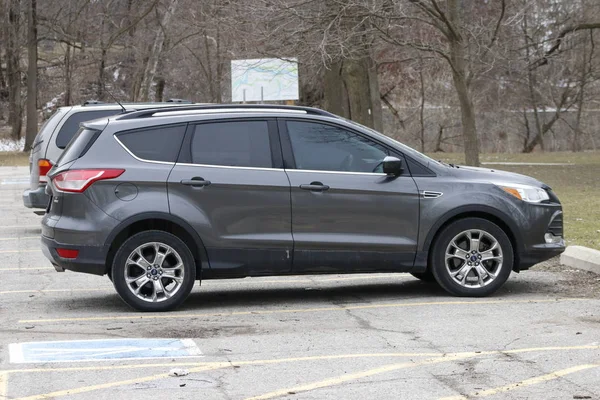 April 02 2019, London Canada: editorial photograph of a grey ford escape SUV car parked in an empty parking lot. The ford escape is one of the most popular mid size cars in Canada. — Stock Photo, Image