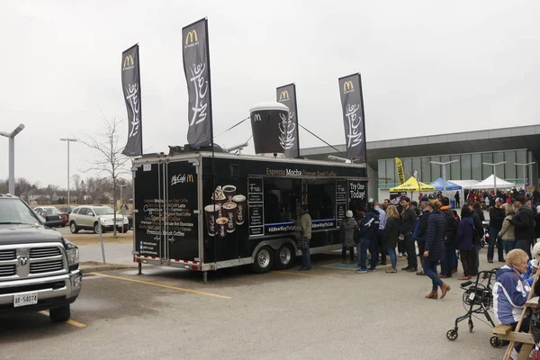 Elmira Canada, April 06 2019: editorial photo of a McCafe mobile trailor serving people coffee at the maple syrup festival. Free coffee was offered for the cold weather