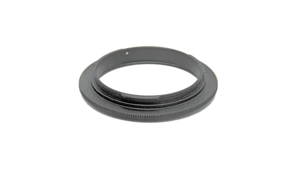 Adaptador de anel para a lente sobre um fundo branco — Fotografia de Stock