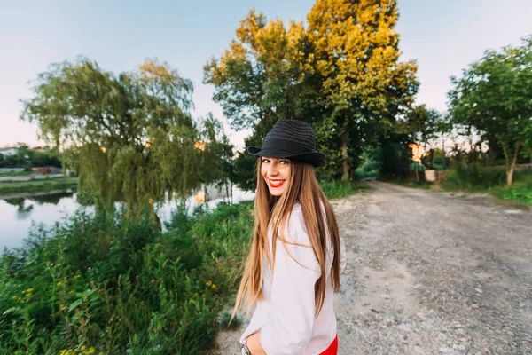 Happy Girl Long Hair Hat Her Head Smiles Genuinely Looks — Stock Photo, Image