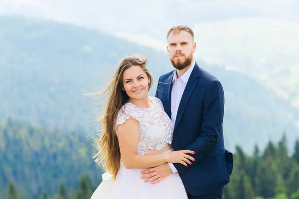 Newlyweds Festive Clothing Embrace Each Other Look Camera Lens — Stock Photo, Image