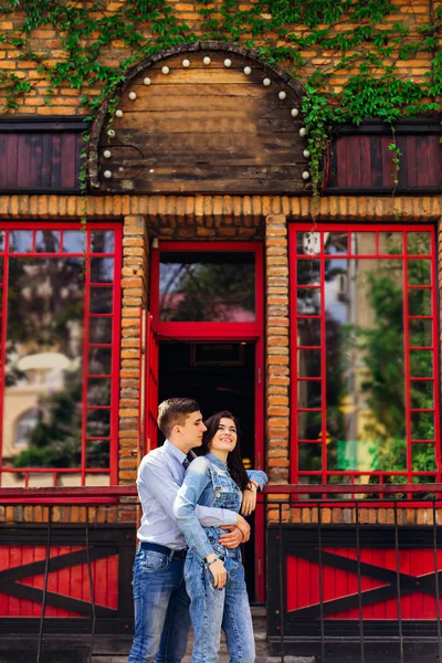 Boy Hugs Girl Who Leans Fence Couple Love Background Building — Stock Photo, Image